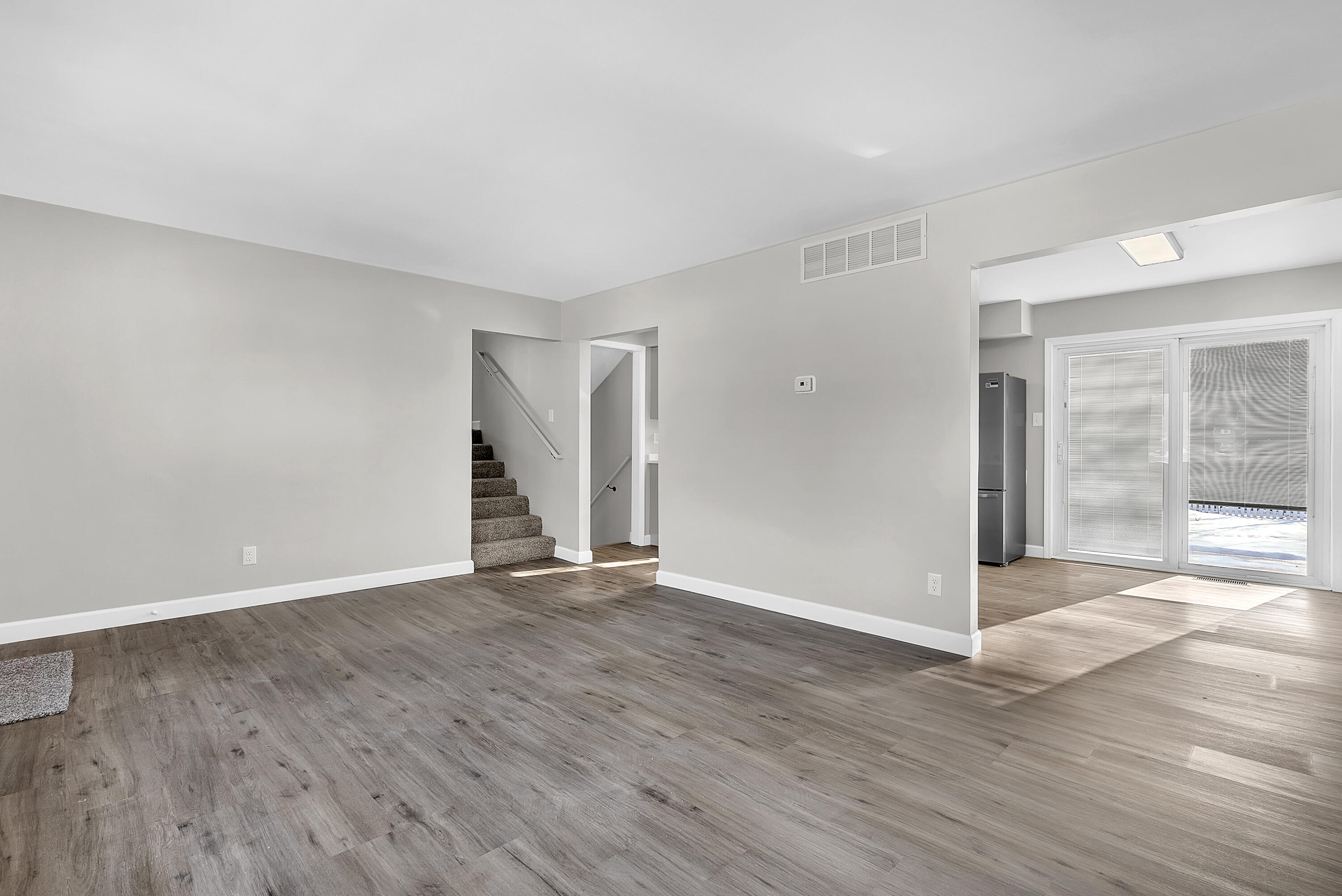 6395 Valleyview Avenue Portage, IN 46368 - Photo 6 of 20 a view of an empty room with wooden floor