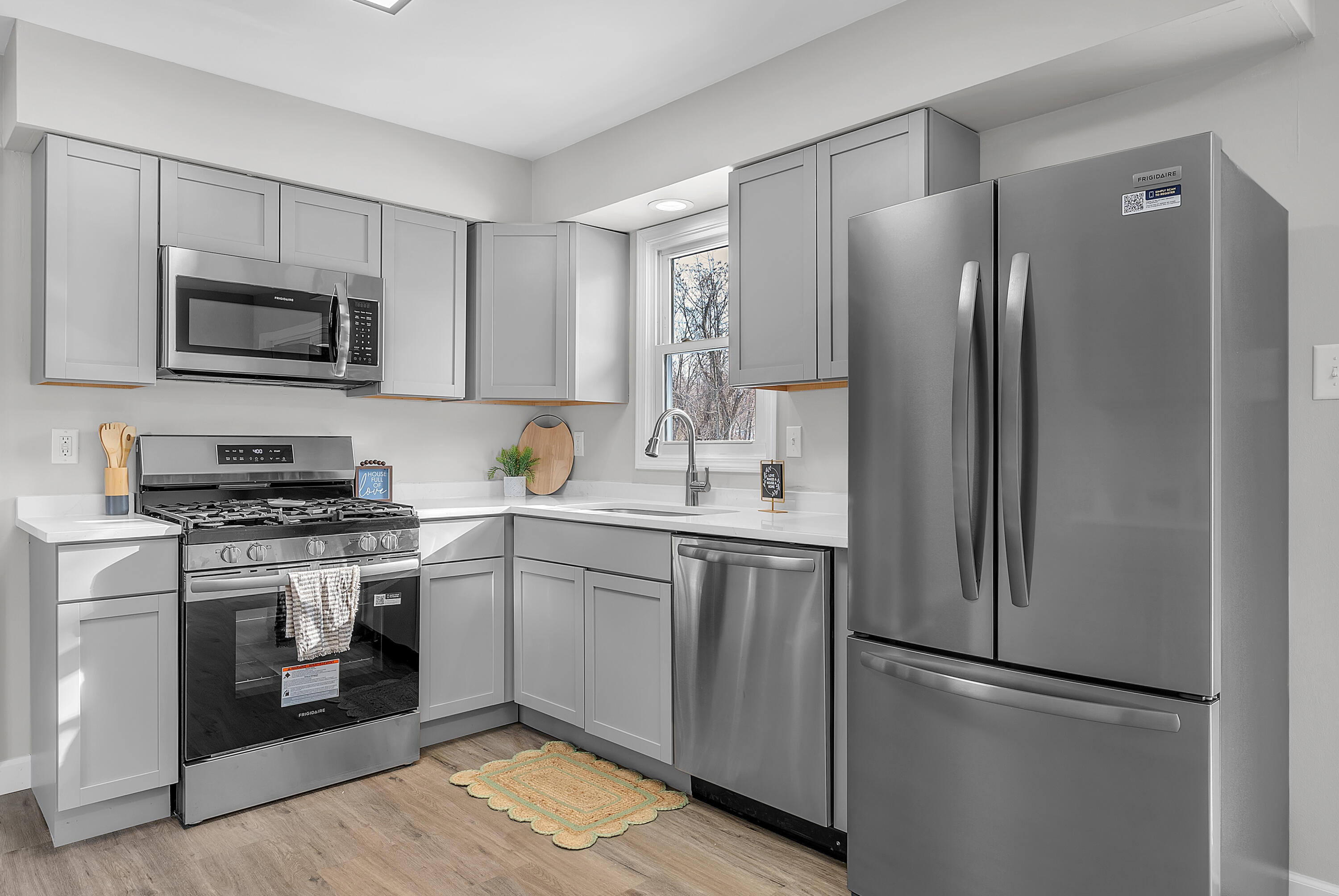 6395 Valleyview Avenue Portage, IN 46368 - Photo 9 of 20 a kitchen with stainless steel appliances granite countertop a refrigerator stove a sink and a microwave