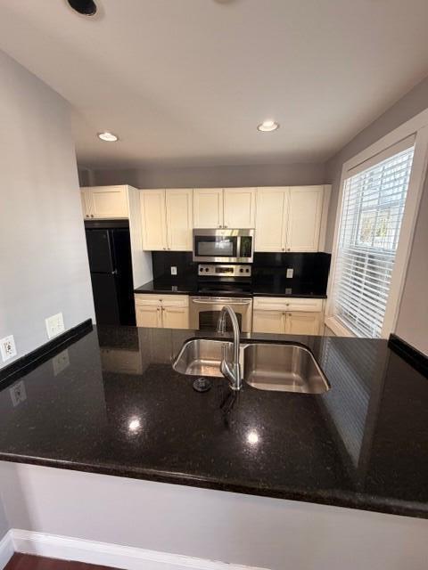 2 Nassau Lane, Unit 2 Key West, FL 33040 - Photo 6 of 12 a kitchen with a sink a counter space cabinets and appliances