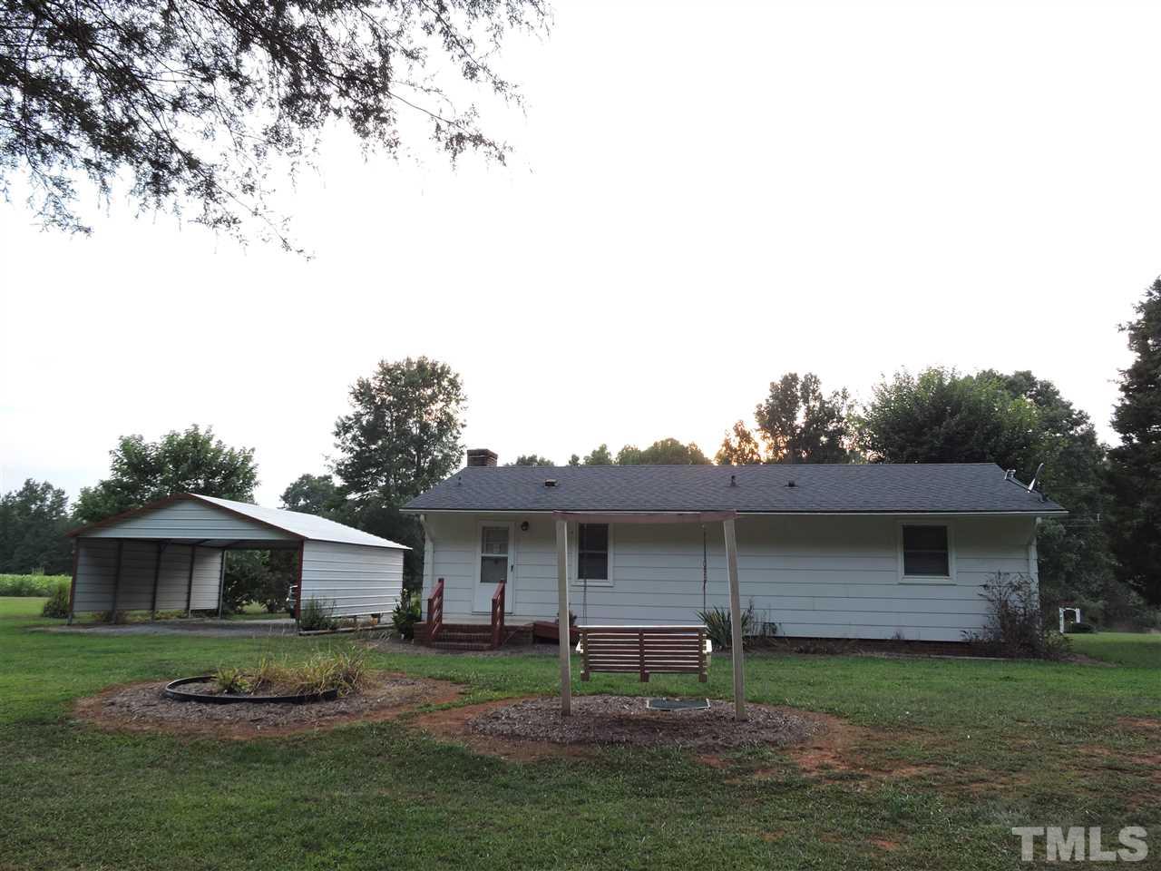 179 Clayton Glenn Road Roxboro, NC 27574 - Photo 11 of 14 a view of a yard in front of a house with large trees