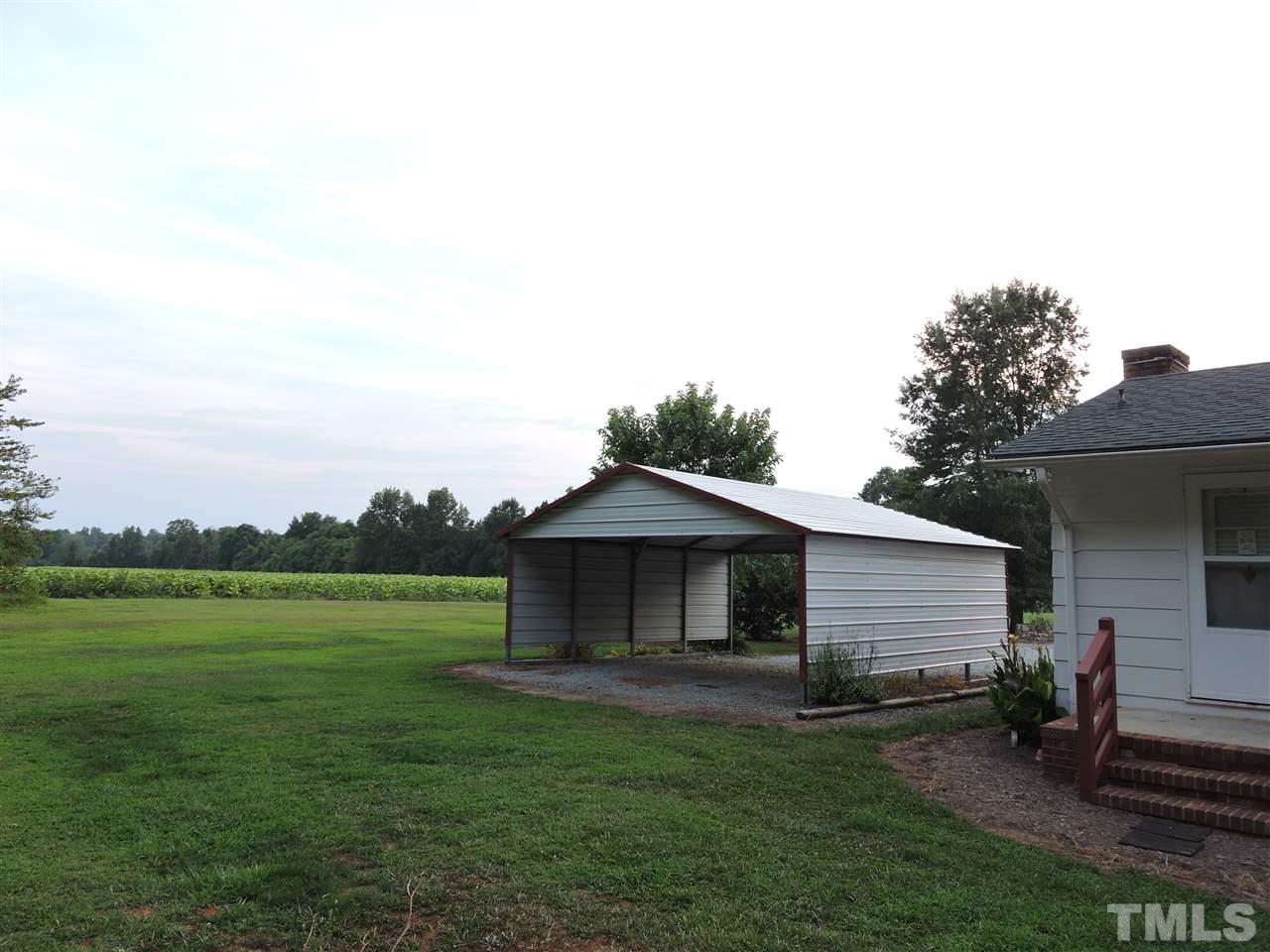 179 Clayton Glenn Road Roxboro, NC 27574 - Photo 13 of 14 a backyard of a house with table and chairs