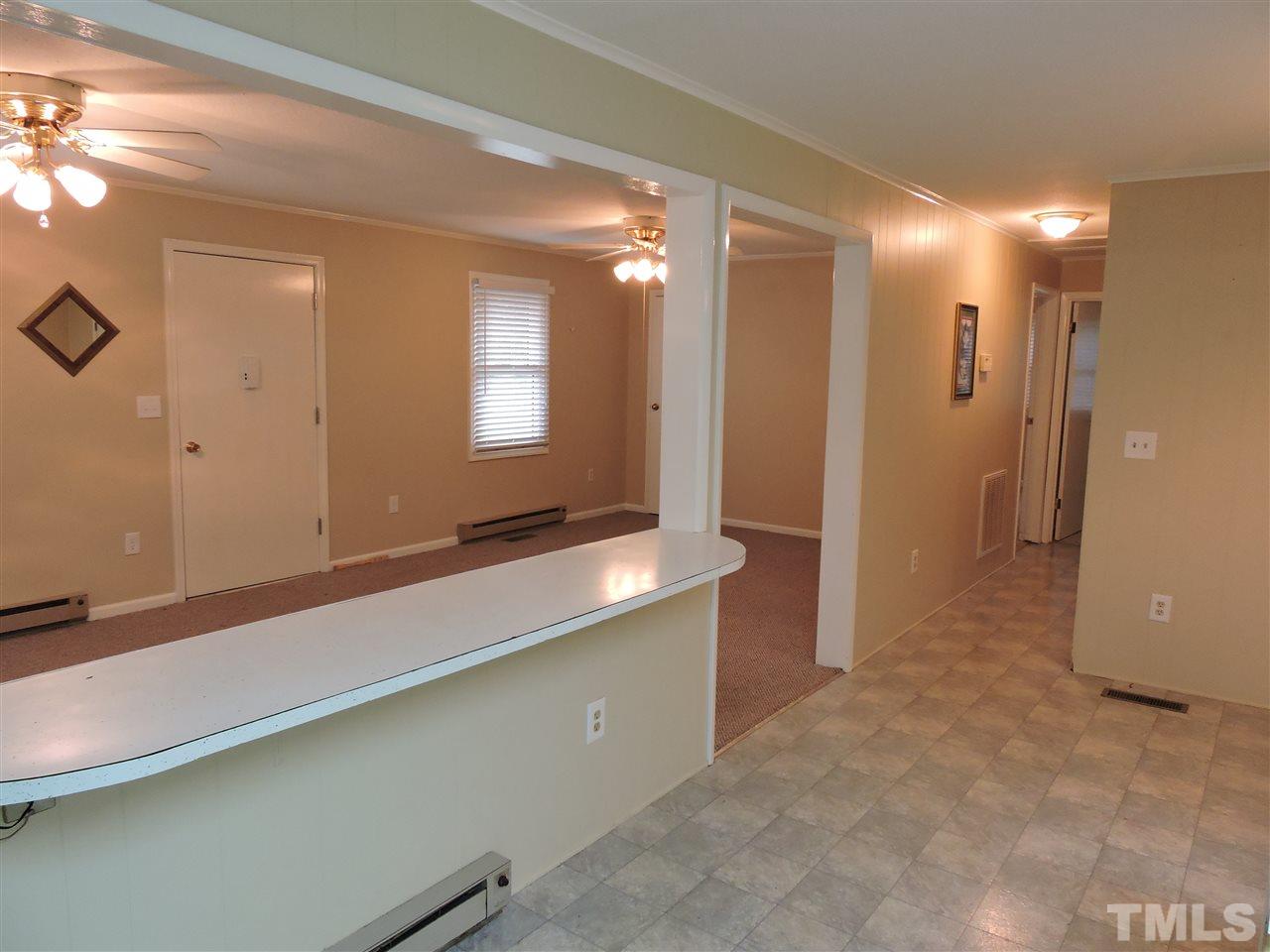 179 Clayton Glenn Road Roxboro, NC 27574 - Photo 4 of 14 a bathroom with a double vanity sink and a mirror