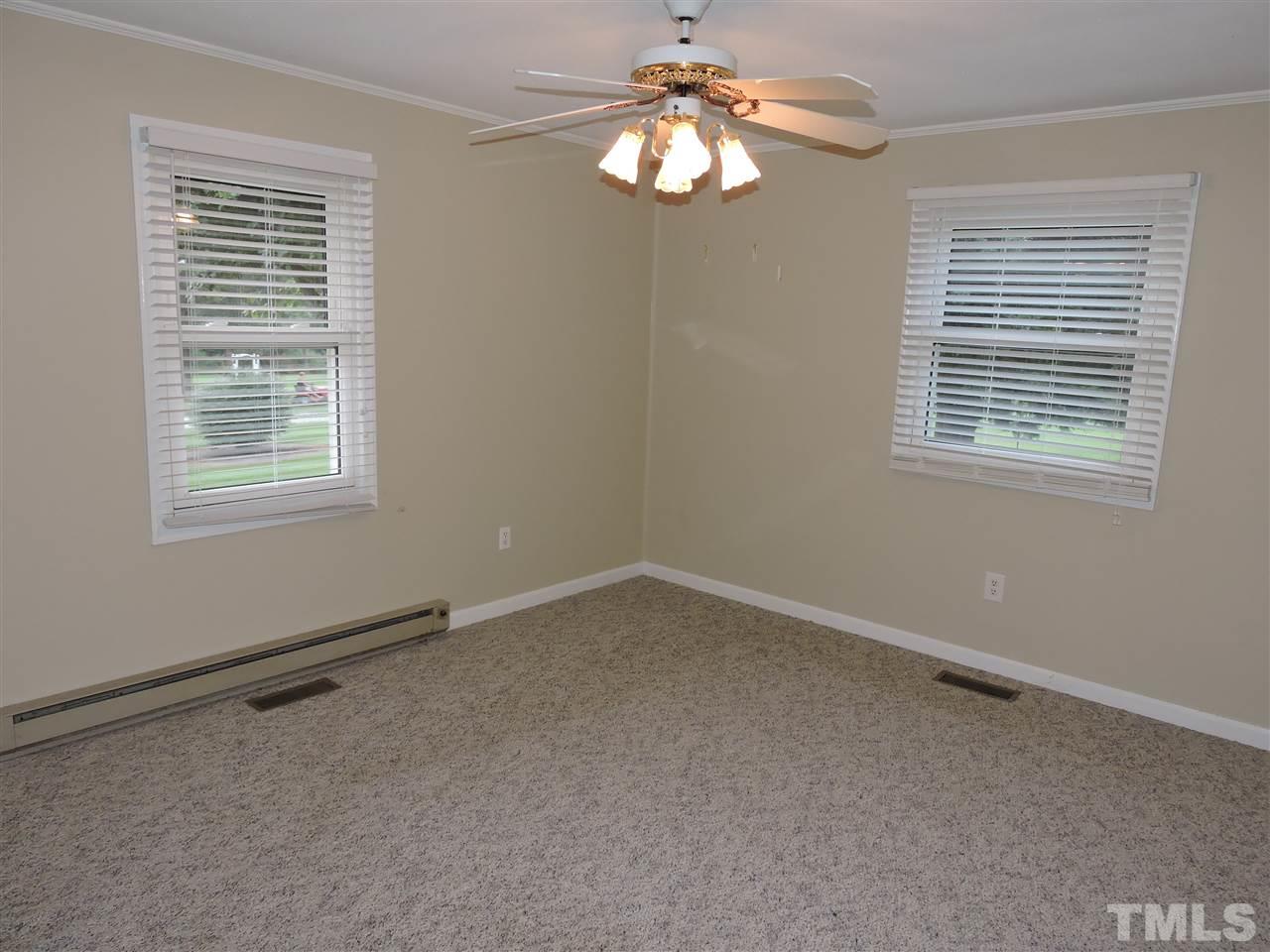 179 Clayton Glenn Road Roxboro, NC 27574 - Photo 6 of 14 a view of an empty room with a window