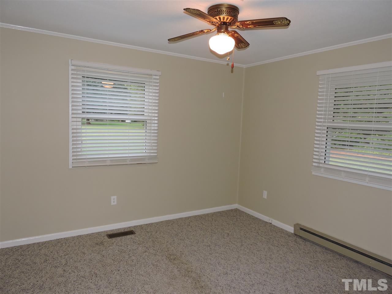 179 Clayton Glenn Road Roxboro, NC 27574 - Photo 7 of 14 a view of an empty room with a window