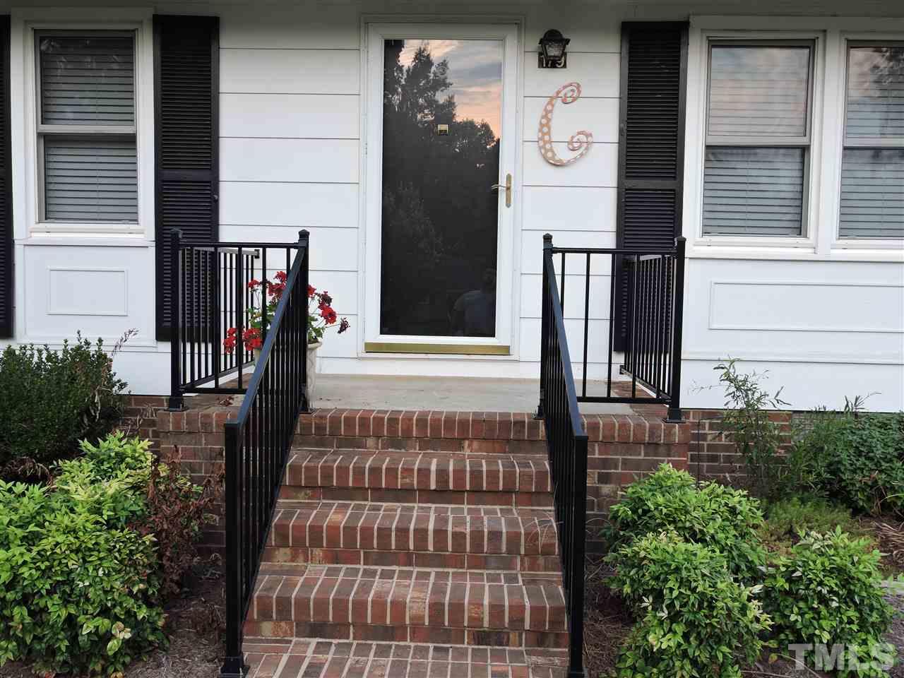 179 Clayton Glenn Road Roxboro, NC 27574 - Photo 10 of 14 a front view of a house with a porch