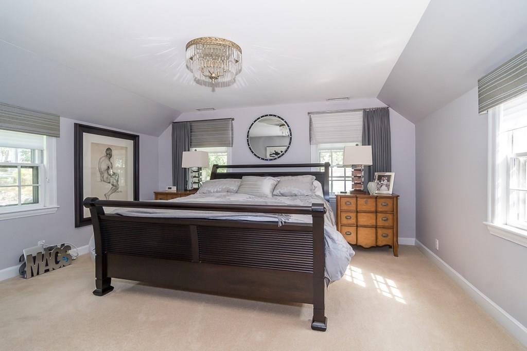 33 Tennyson Road Wellesley, MA 02481 - Photo 18 of 33 a bedroom with a bed and a chandelier