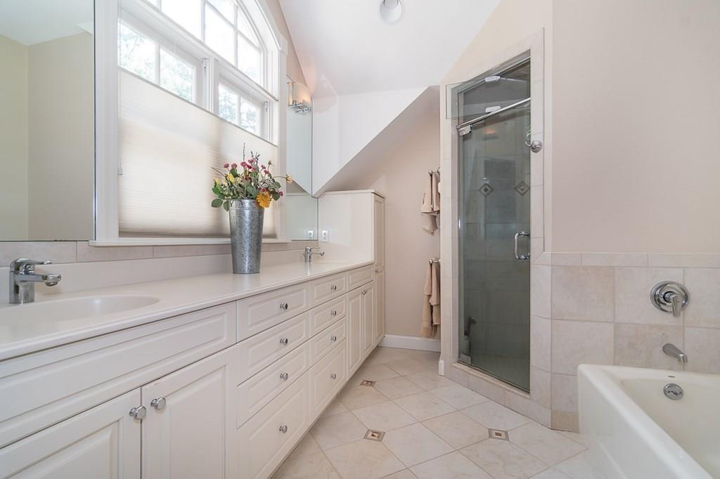 33 Tennyson Road Wellesley, MA 02481 - Photo 19 of 33 a bathroom with a double vanity sink and a bathtub