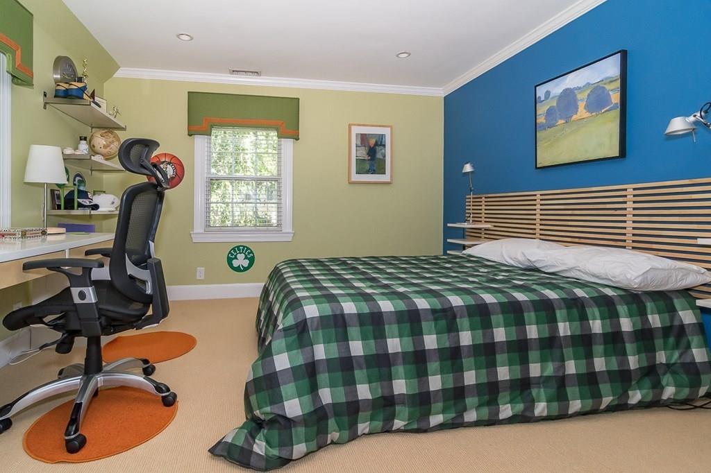 33 Tennyson Road Wellesley, MA 02481 - Photo 22 of 33 a bedroom with a bed a dresser and chair