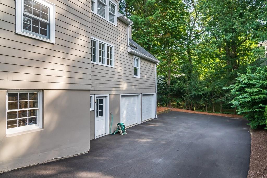 33 Tennyson Road Wellesley, MA 02481 - Photo 27 of 33 a view of a house with backyard and plants