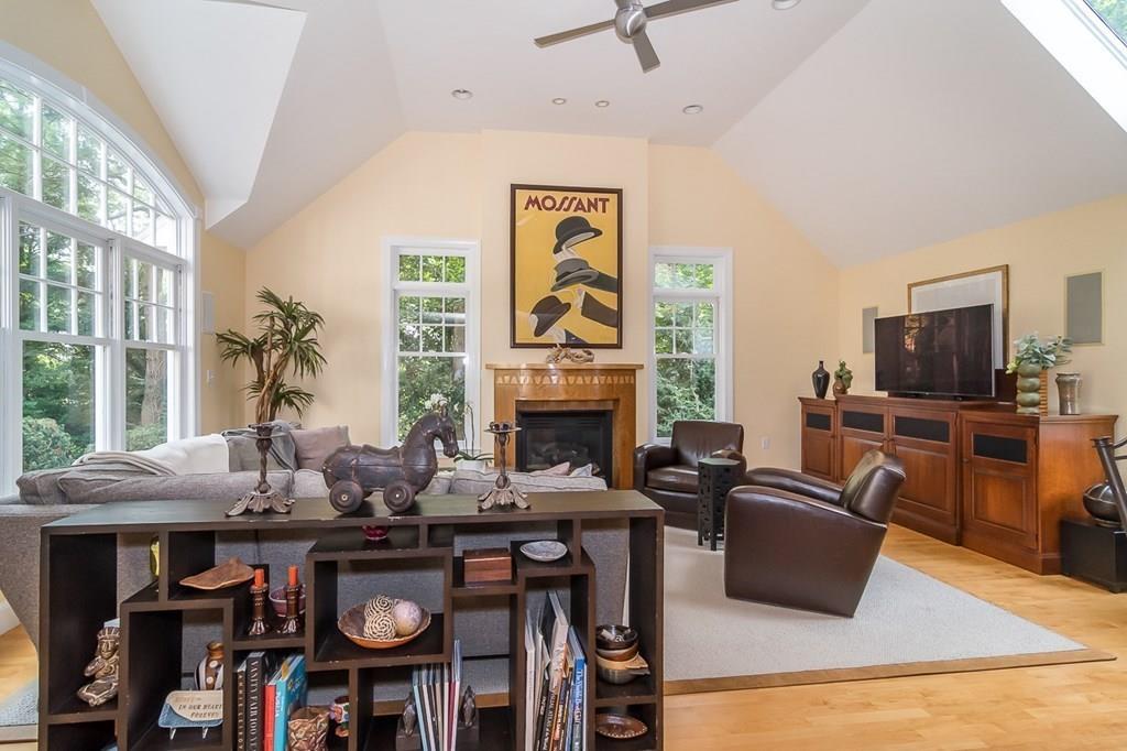 33 Tennyson Road Wellesley, MA 02481 - Photo 8 of 33 a living room with furniture a fireplace and a flat screen tv