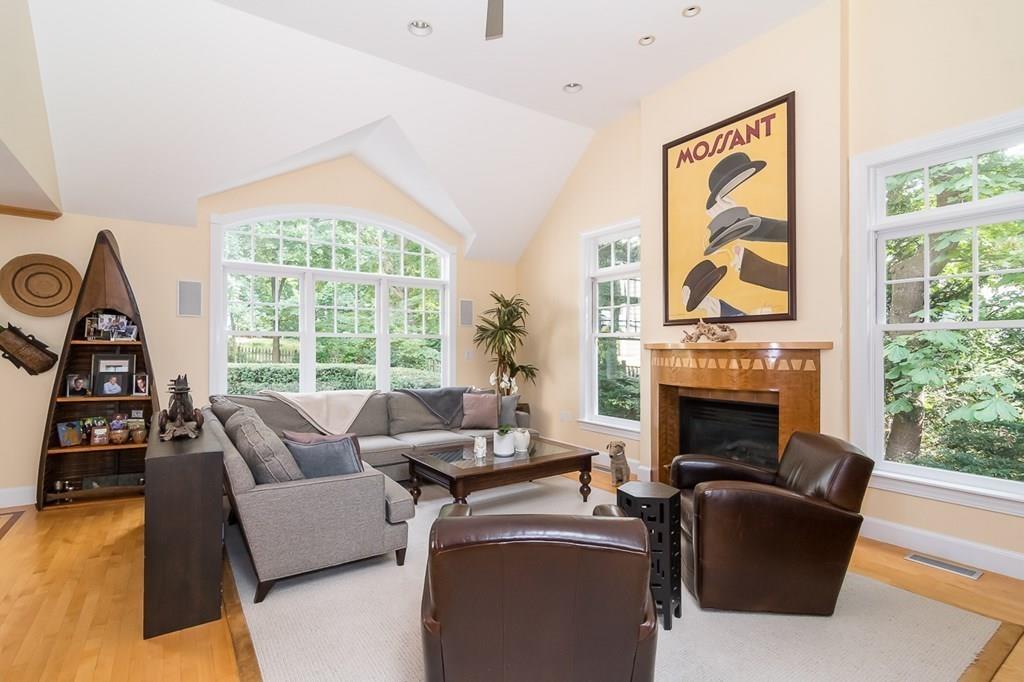 33 Tennyson Road Wellesley, MA 02481 - Photo 9 of 33 a living room with furniture a flat screen tv and a fireplace