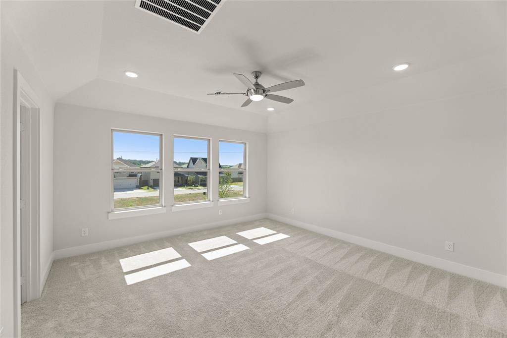 1610 Mint Road Argyle, TX 76226 - Photo 21 of 27 an empty room with windows and fan