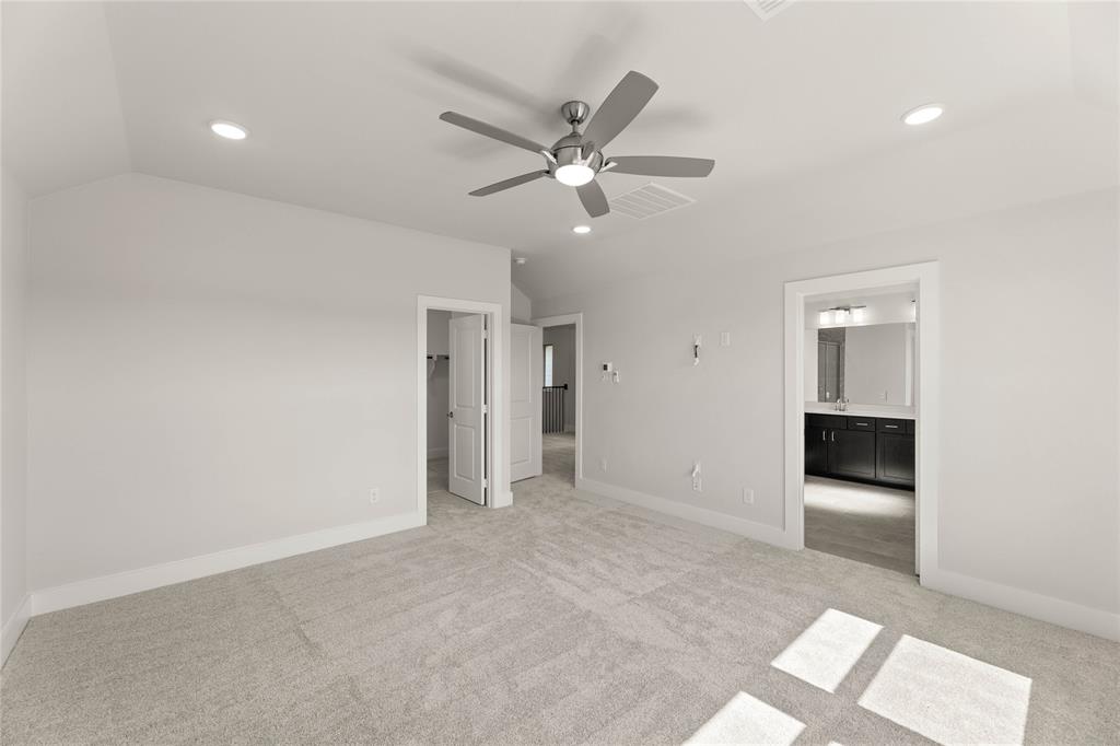 1610 Mint Road Argyle, TX 76226 - Photo 22 of 27 a view of an empty room with a ceiling fan