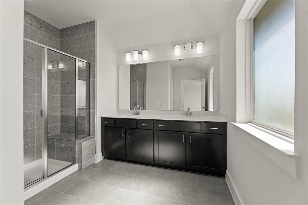 1610 Mint Road Argyle, TX 76226 - Photo 24 of 27 a bathroom with a sink and a mirror