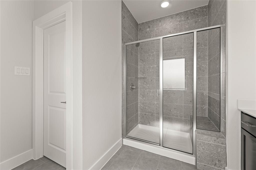 1610 Mint Road Argyle, TX 76226 - Photo 26 of 27 a bathroom with a glass shower door