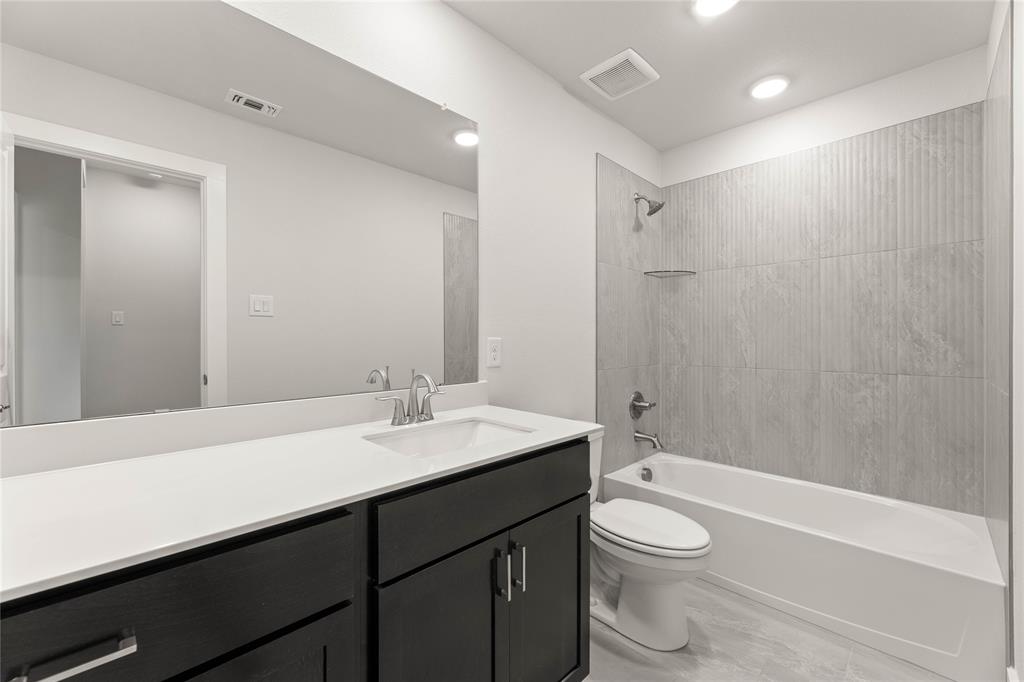 1610 Mint Road Argyle, TX 76226 - Photo 27 of 27 a bathroom with a sink a toilet and shower