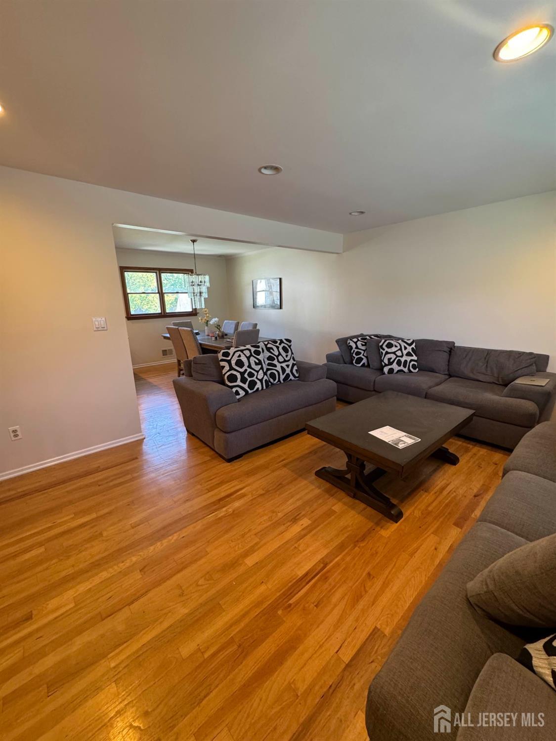 5 Timothy Court Edison, NJ 08837 - Photo 14 of 21 a living room with furniture and wooden floor