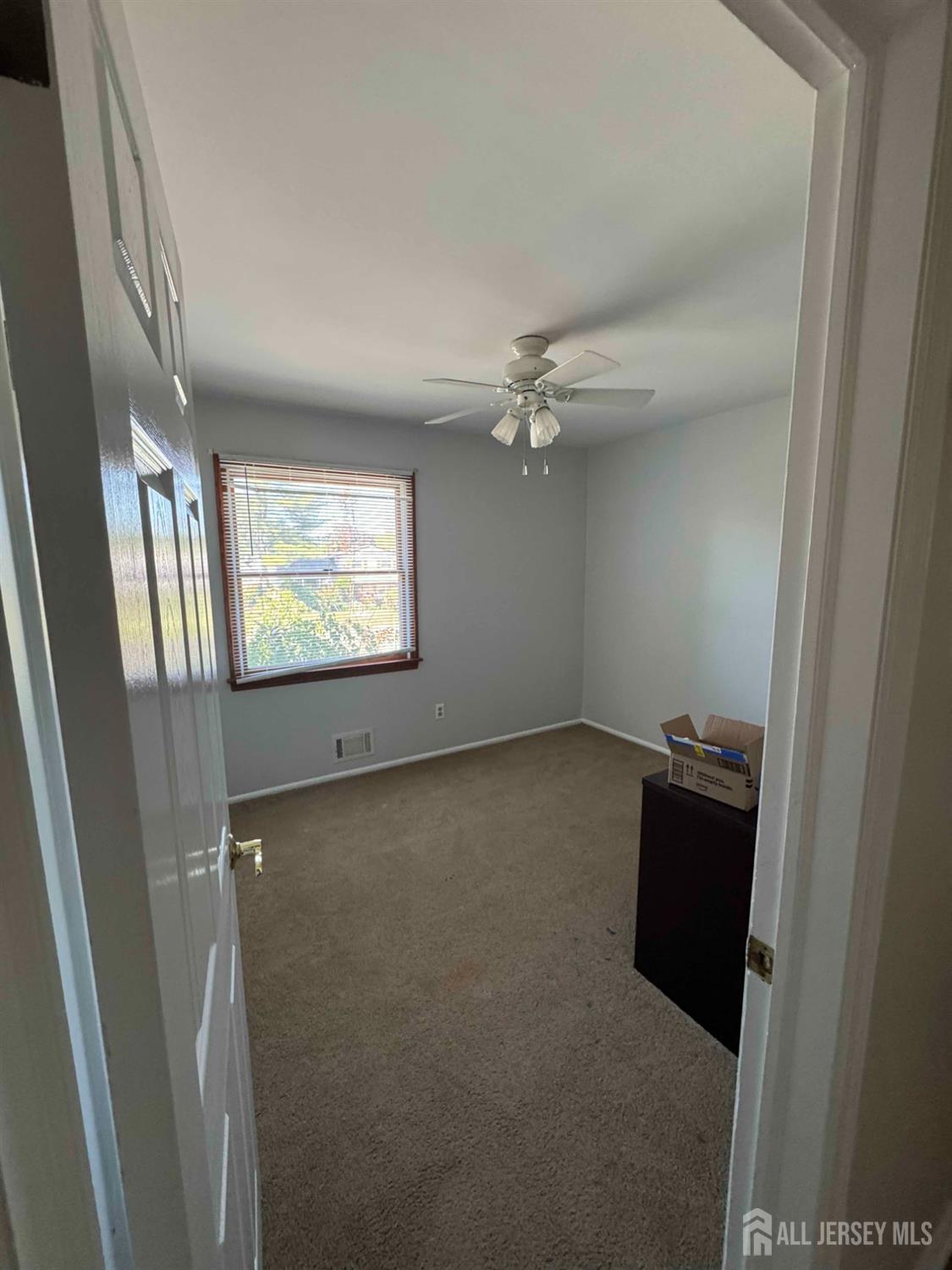 5 Timothy Court Edison, NJ 08837 - Photo 20 of 21 a view of an empty room with a window