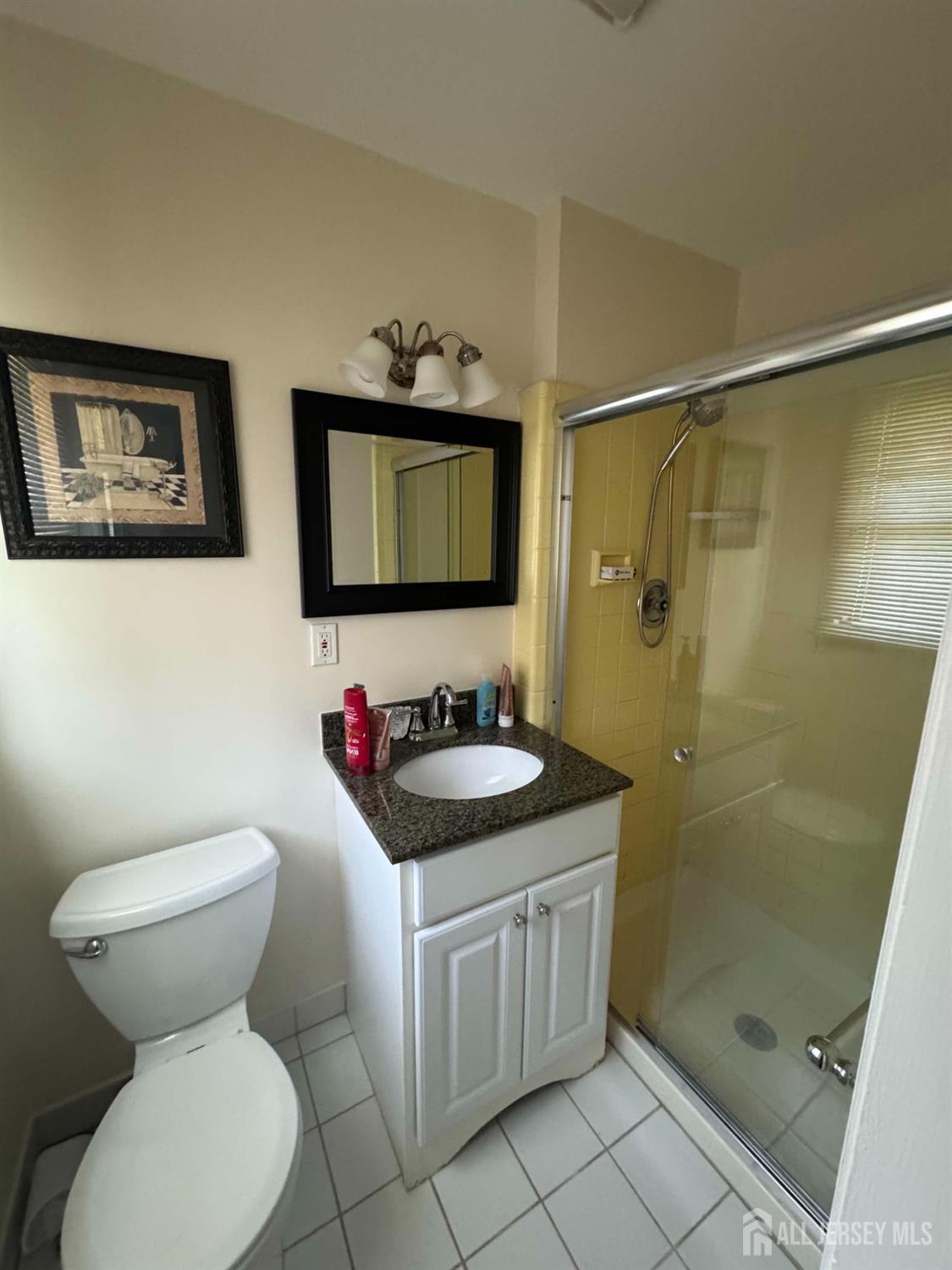 5 Timothy Court Edison, NJ 08837 - Photo 21 of 21 a bathroom with a toilet sink and shower