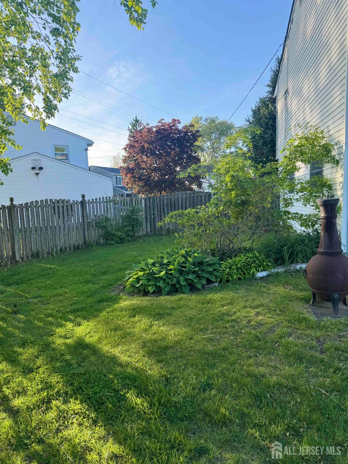 5 Timothy Court Edison, NJ 08837 - Photo 7 of 21 a view of a backyard with a garden