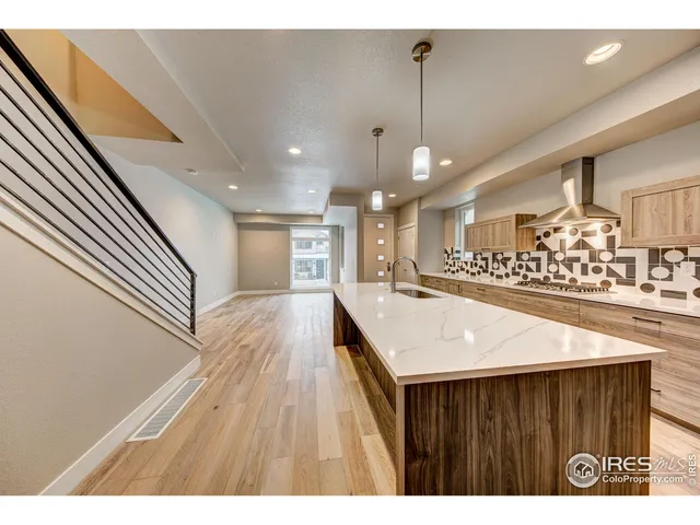 a open kitchen view with wooden floor