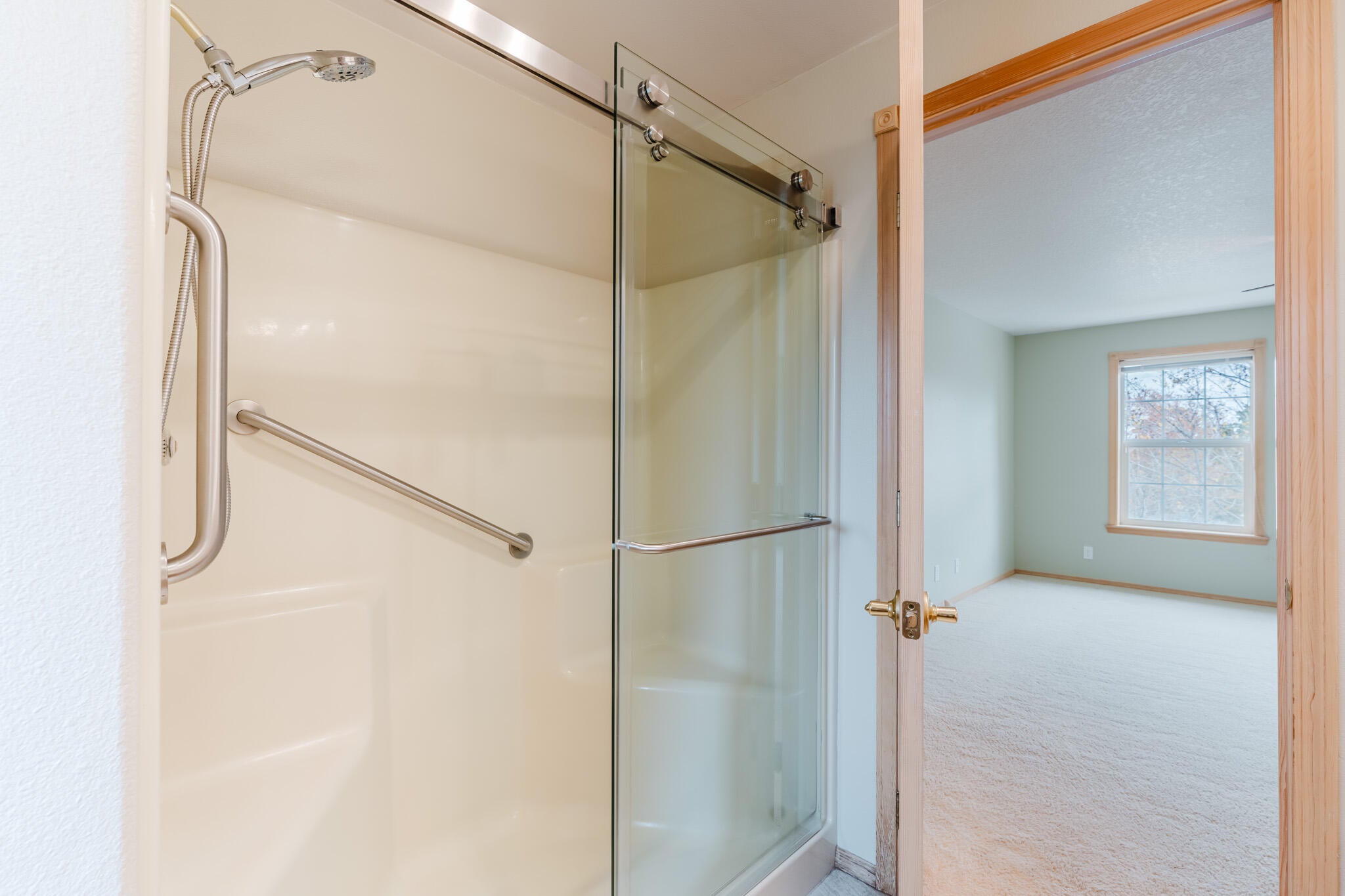 3626 Southwest Volcano Court Redmond, OR 97756 - Photo 41 of 89 This is the walk-in shower in the primary suite, also with a sliding glass door.