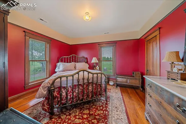 a bedroom with furniture and a window