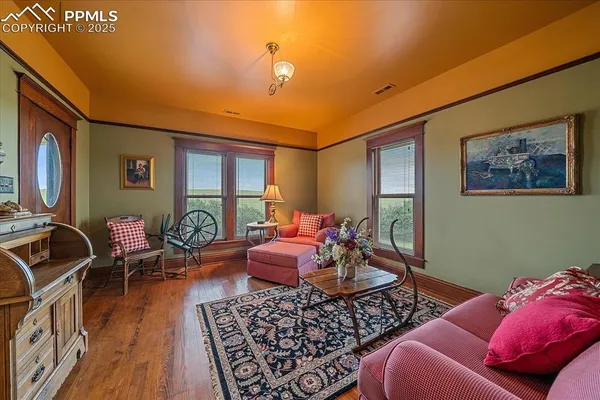 a bedroom with furniture and a window
