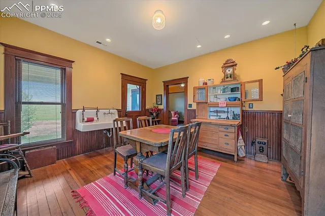 a view of a dining room with furniture window and wooden floor
