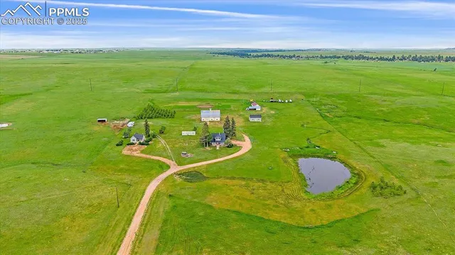 a view of a field with an outdoor space
