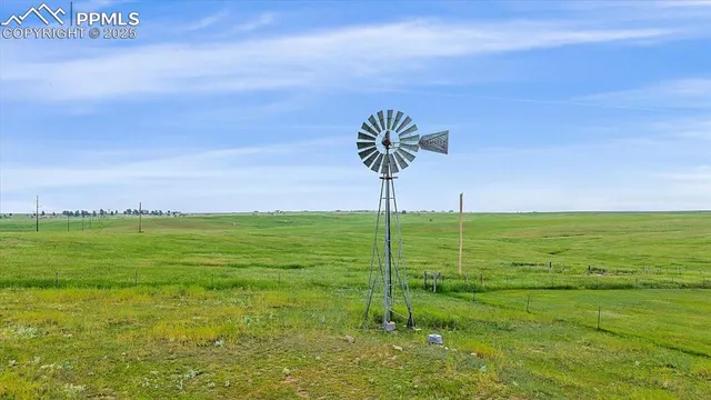 a view of a golf course with chairs