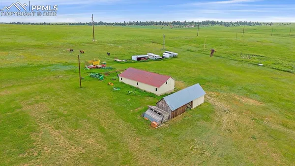 a view of a garden with a building in the background