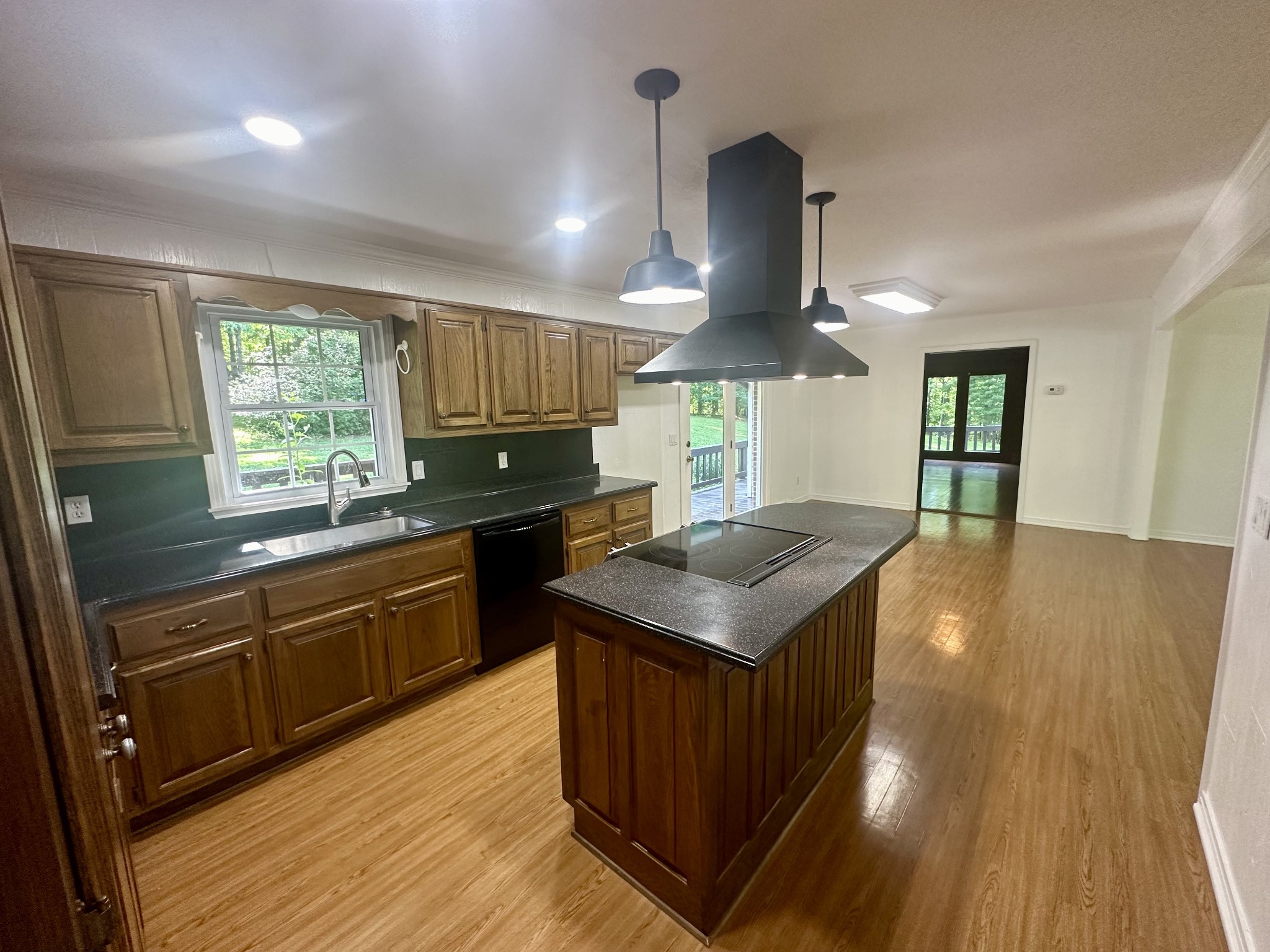 61 Nelson Road Lawrenceburg, TN 38464 - Photo 14 of 55 a kitchen with stainless steel appliances granite countertop a sink a stove and a wooden floors