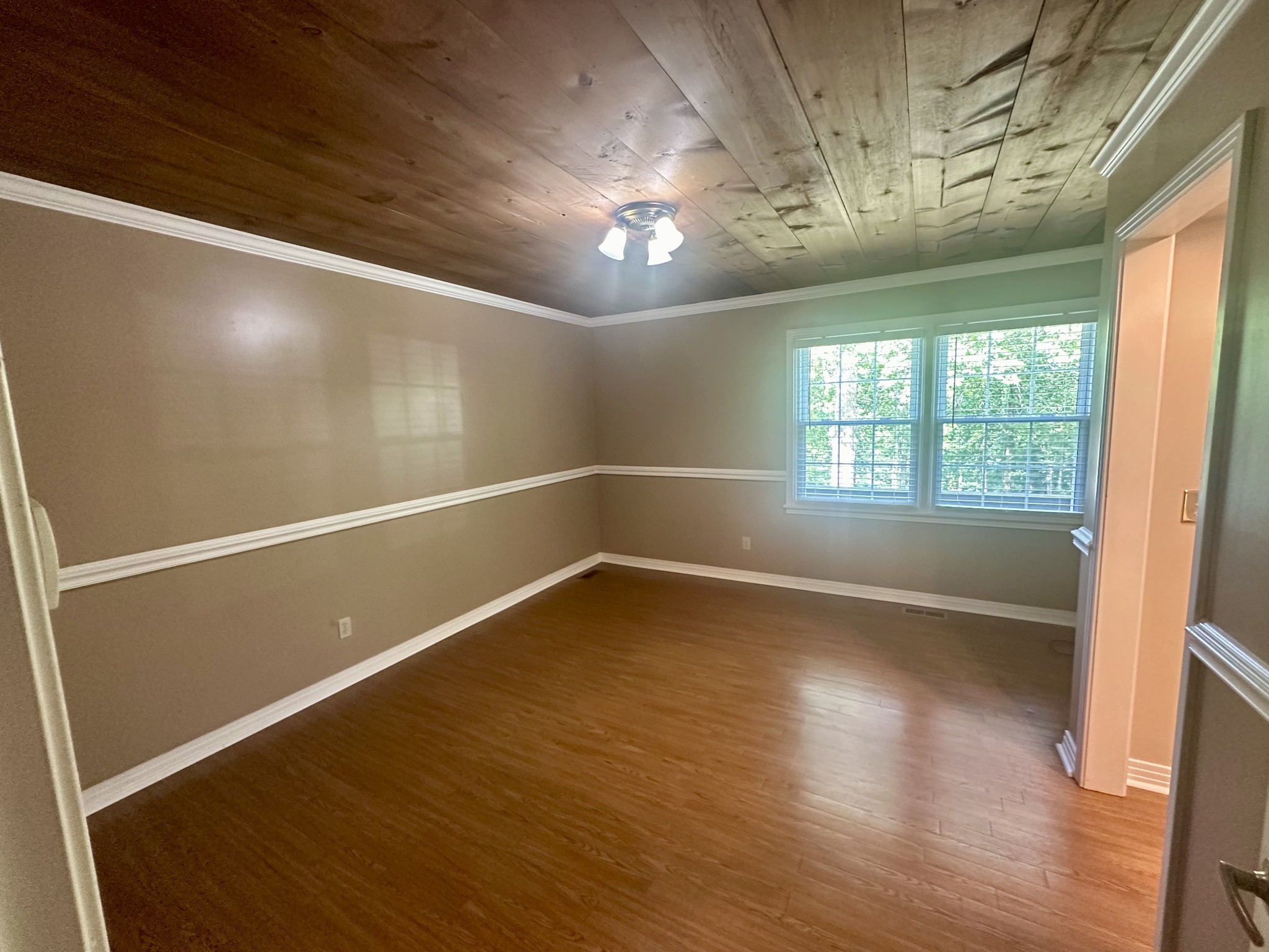 61 Nelson Road Lawrenceburg, TN 38464 - Photo 19 of 55 an empty room with wooden floor and windows