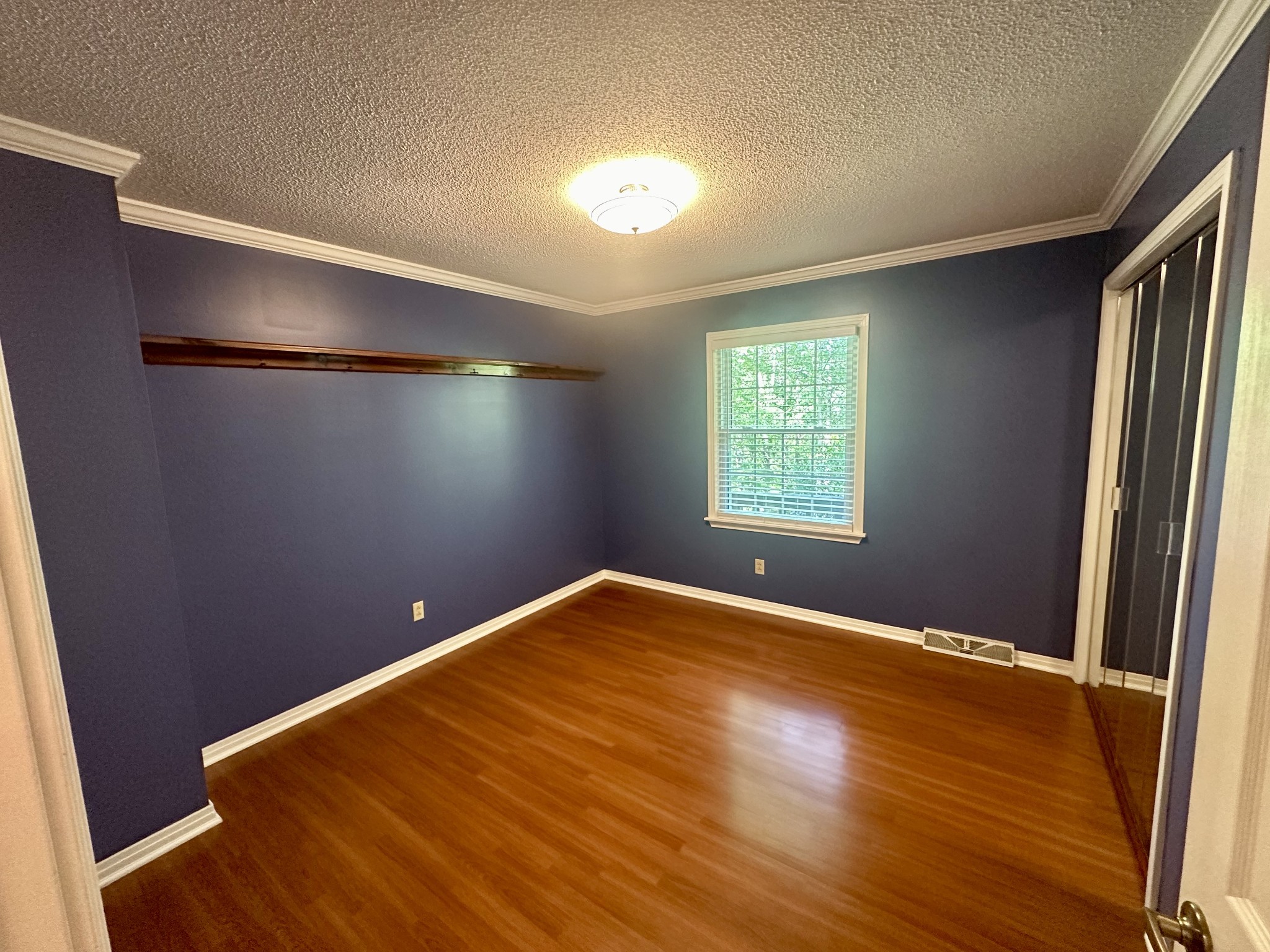 61 Nelson Road Lawrenceburg, TN 38464 - Photo 25 of 55 a view of an empty room with wooden floor and a window