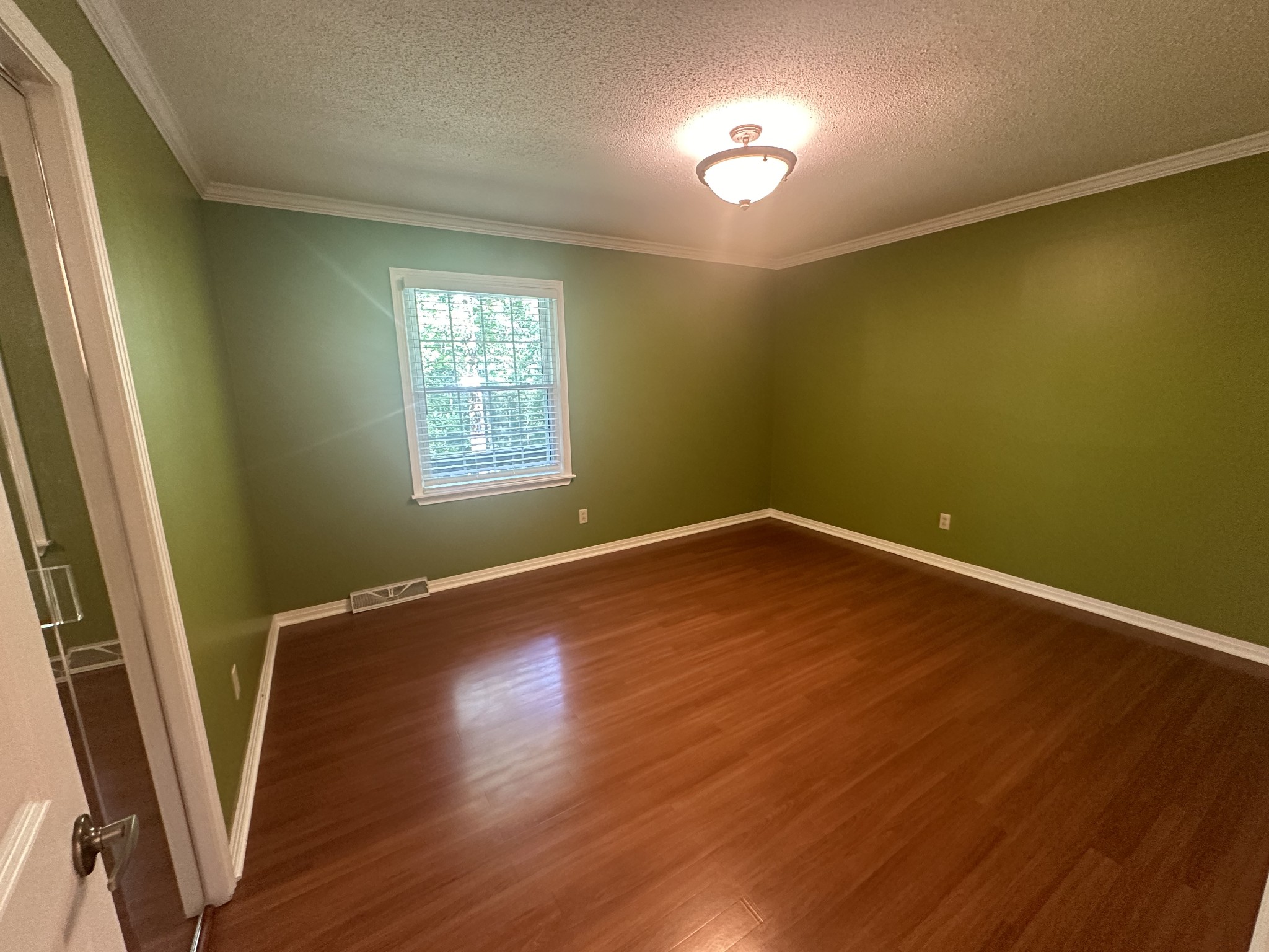 61 Nelson Road Lawrenceburg, TN 38464 - Photo 27 of 55 a view of empty room with wooden floor and fan
