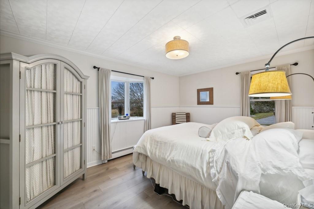 70 South Delrey Road Montauk, NY 11954 - Photo 13 of 22 a bedroom with a bed next to a window