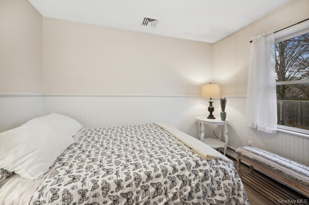 70 South Delrey Road Montauk, NY 11954 - Photo 16 of 22 a bedroom with a bed and a large window