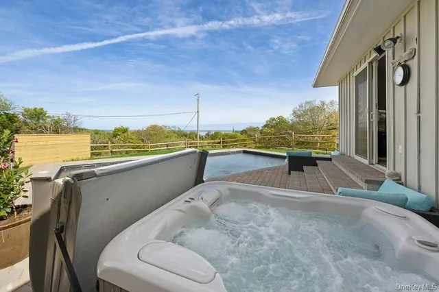 a view of a terrace with wooden floor and outdoor seating