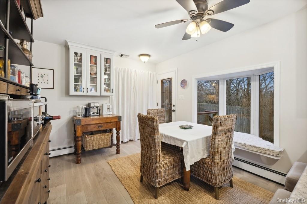 70 South Delrey Road Montauk, NY 11954 - Photo 4 of 22 a view of a dining room with furniture window and wooden floor