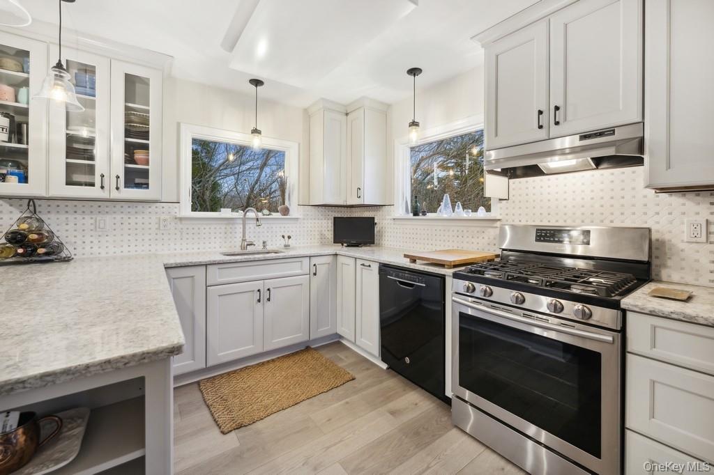 70 South Delrey Road Montauk, NY 11954 - Photo 7 of 22 a kitchen with granite countertop cabinets stainless steel appliances and sink