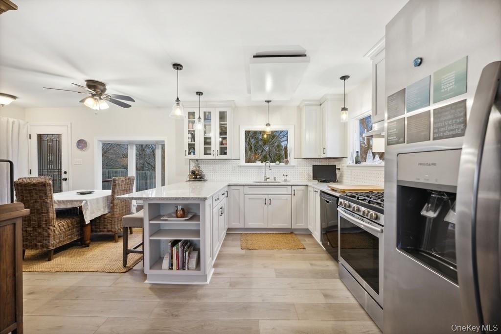 70 South Delrey Road Montauk, NY 11954 - Photo 9 of 22 a kitchen with stainless steel appliances kitchen island granite countertop a stove top oven a sink a counter top space and cabinets