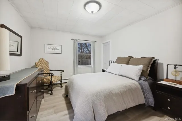 a bedroom with a bed and a desk