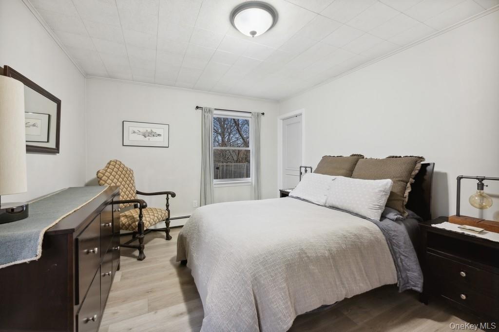 70 South Delrey Road Montauk, NY 11954 - Photo 10 of 22 a bedroom with a bed and a desk