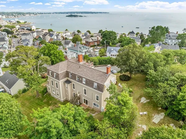an aerial view of multiple house with lake view