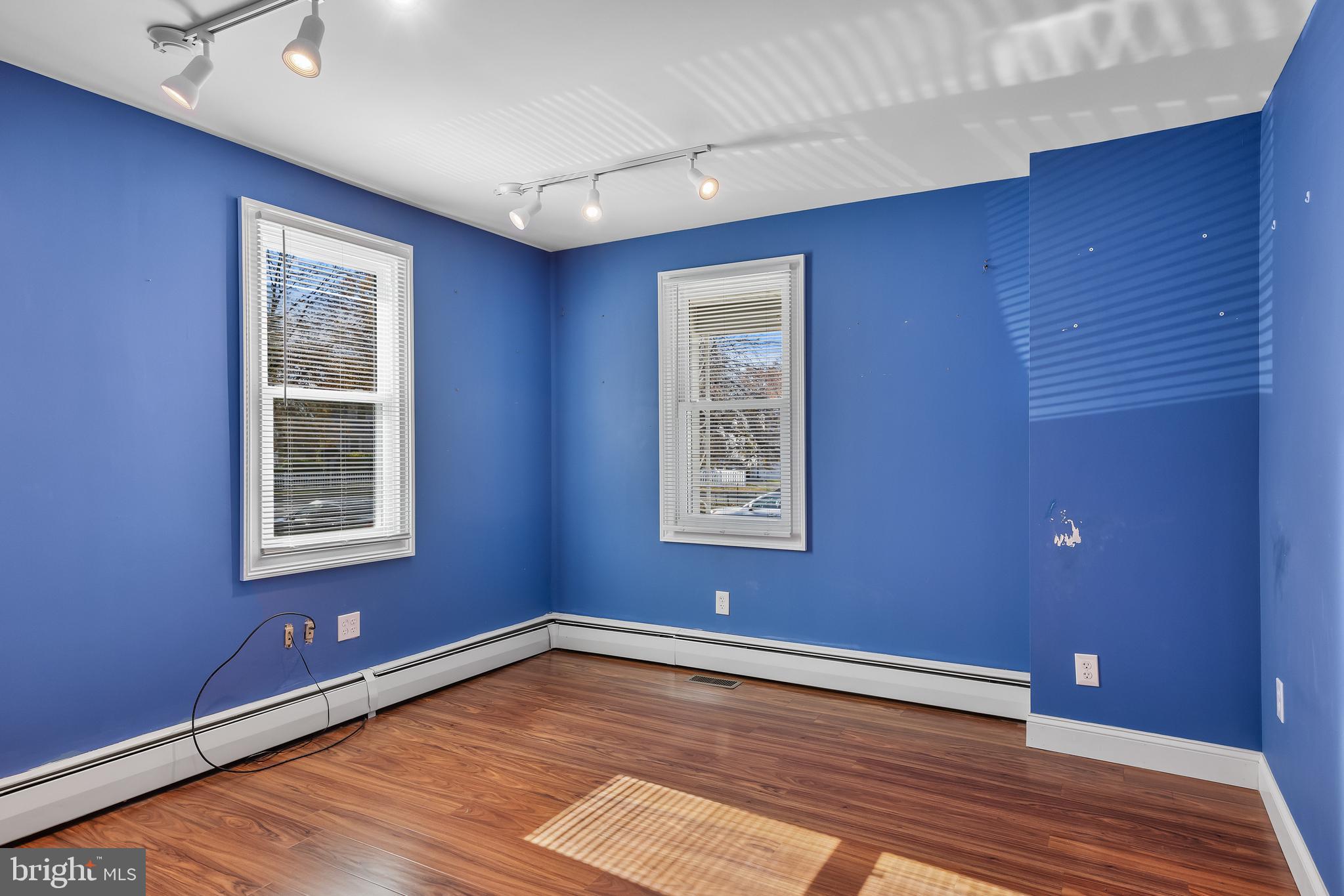 19 South Chestnut Avenue Maple Shade, NJ 08052 - Photo 14 of 31 a view of an empty room with a window and wooden floor
