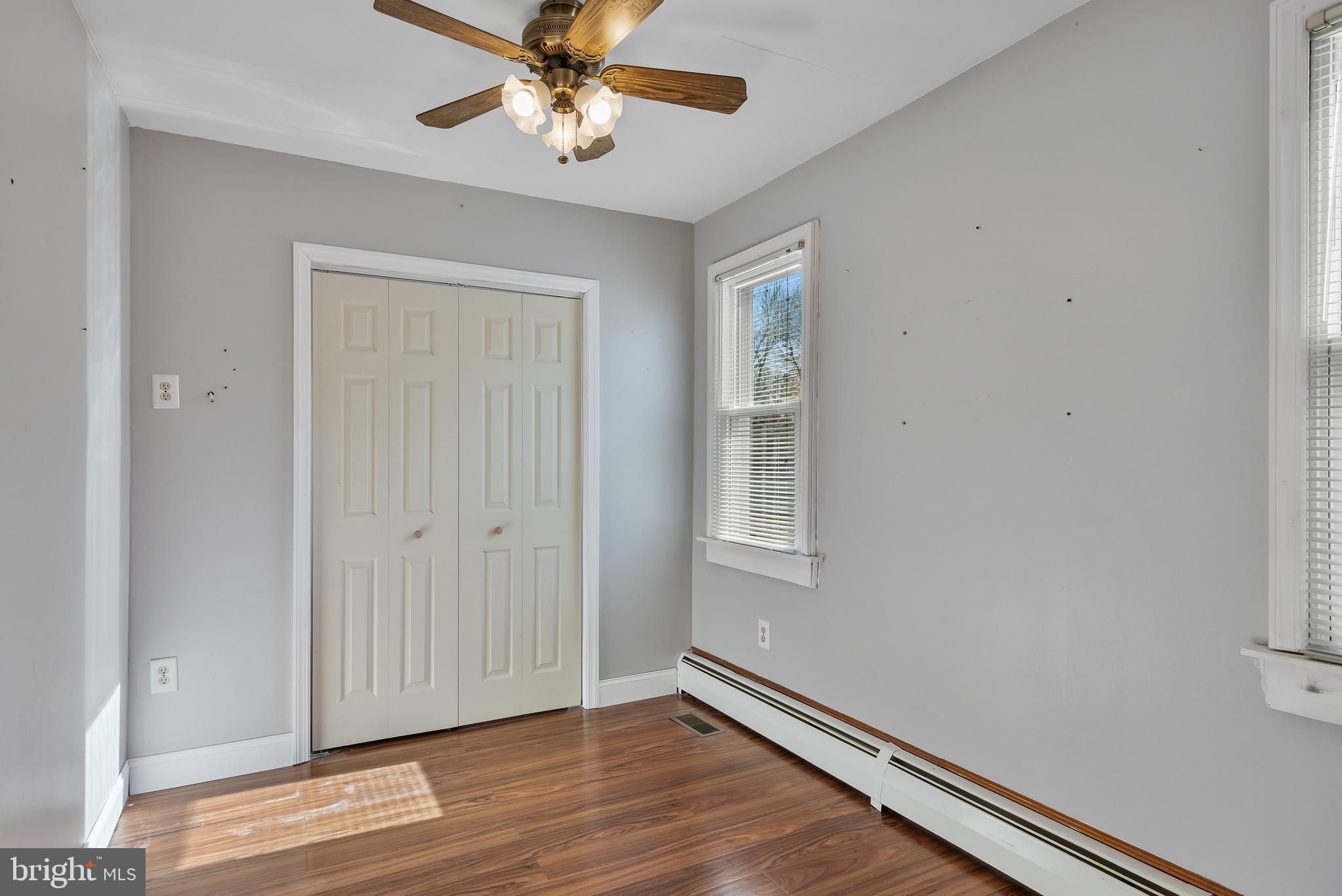 19 South Chestnut Avenue Maple Shade, NJ 08052 - Photo 16 of 31 a view of an empty room with wooden floor and a window