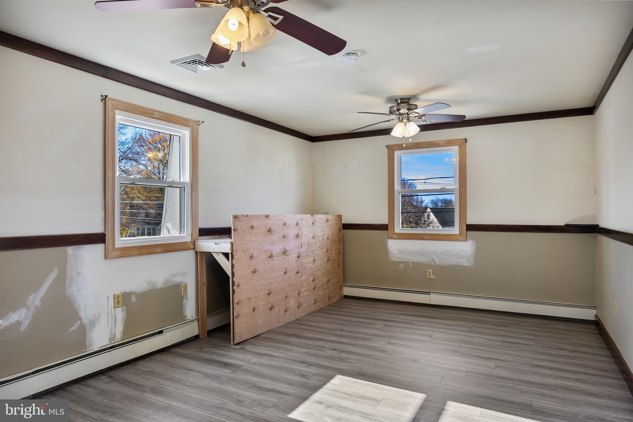 19 South Chestnut Avenue Maple Shade, NJ 08052 - Photo 20 of 31 wooden floor in an empty room with a window