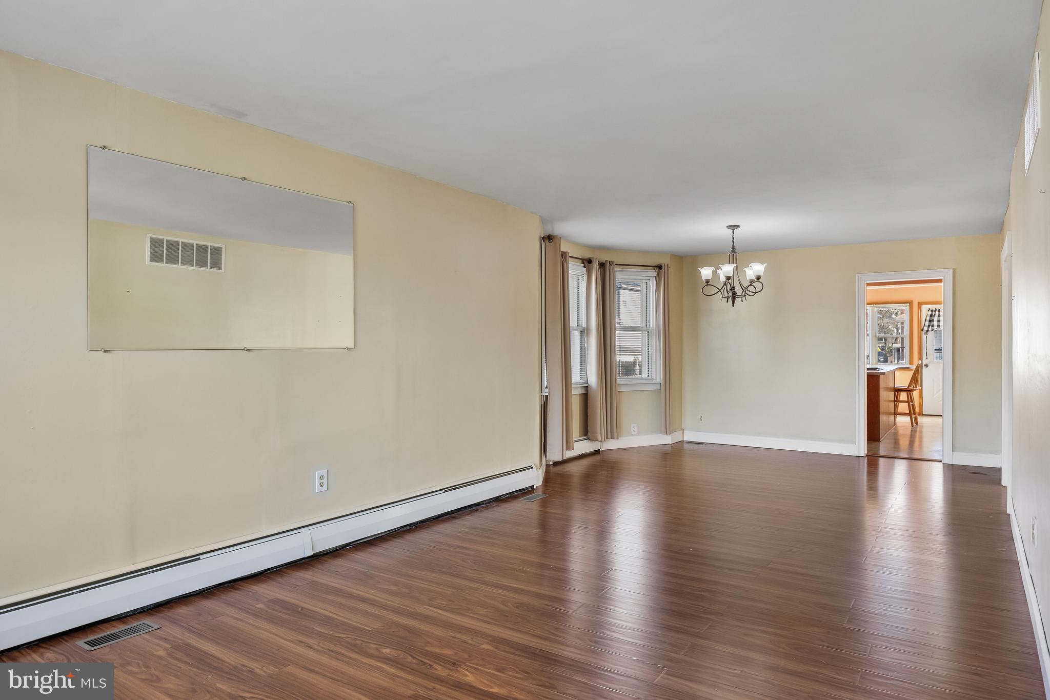 19 South Chestnut Avenue Maple Shade, NJ 08052 - Photo 5 of 31 a view of an empty room with wooden floor and a window