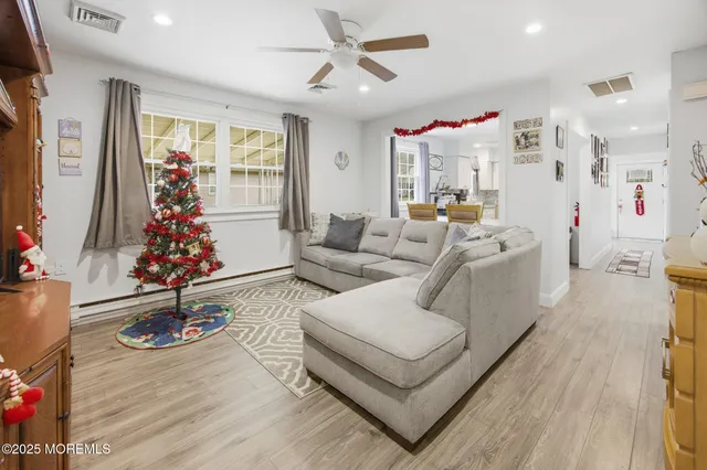 a living room with furniture or window and a table